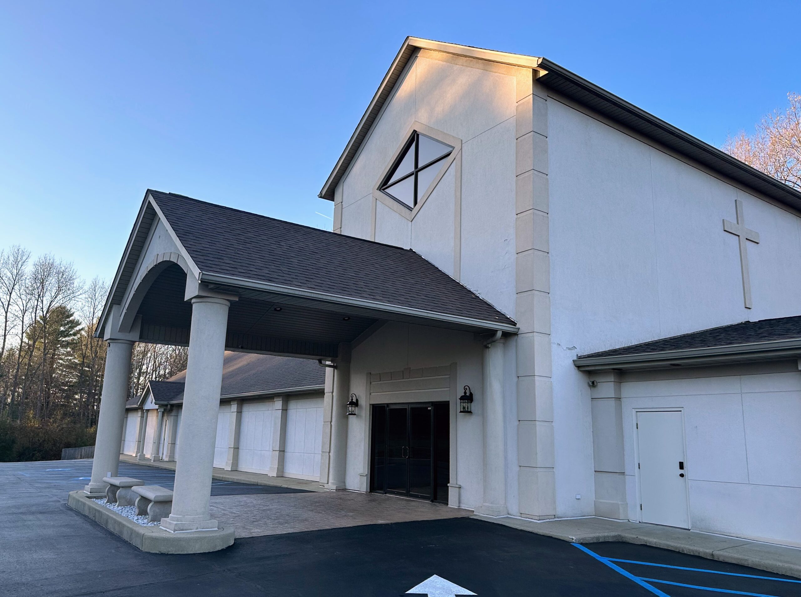 Soul's Harbor church showcasing a new roofing system installed by Greg's Roofing & Contracting in Bloomington, Indiana, with a diamond-shaped window detail.