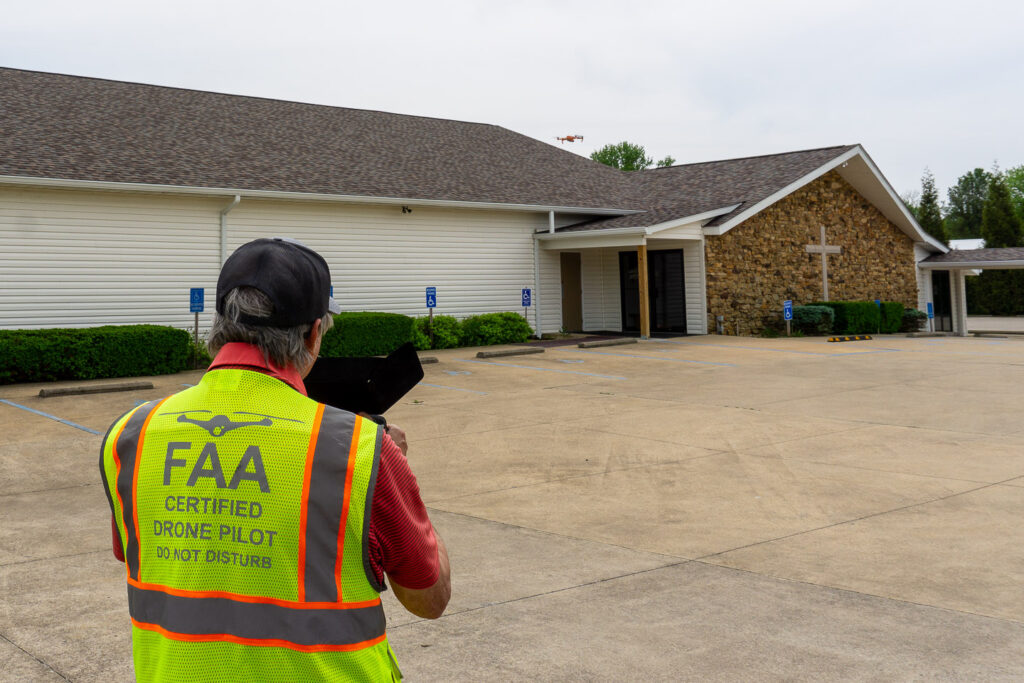 FAA-certified drone pilot capturing footage of McCormick's Creek Church.