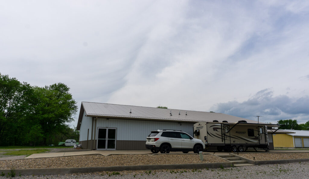 Facilities at McCormick's Creek Church, including a parked vehicle and an RV.