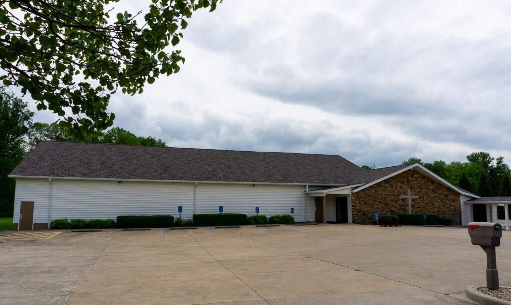 iew of the parking lot and front of McCormick's Creek Church.