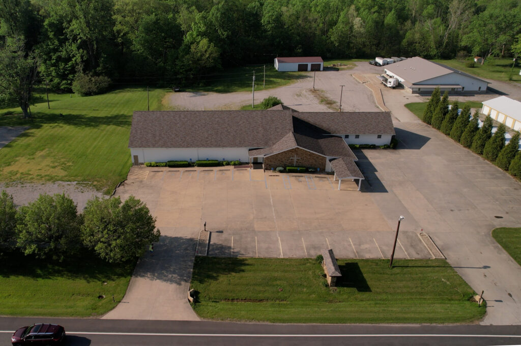 Aerial view of McCormick's Creek Church showcasing the newly restored roof and surrounding area.